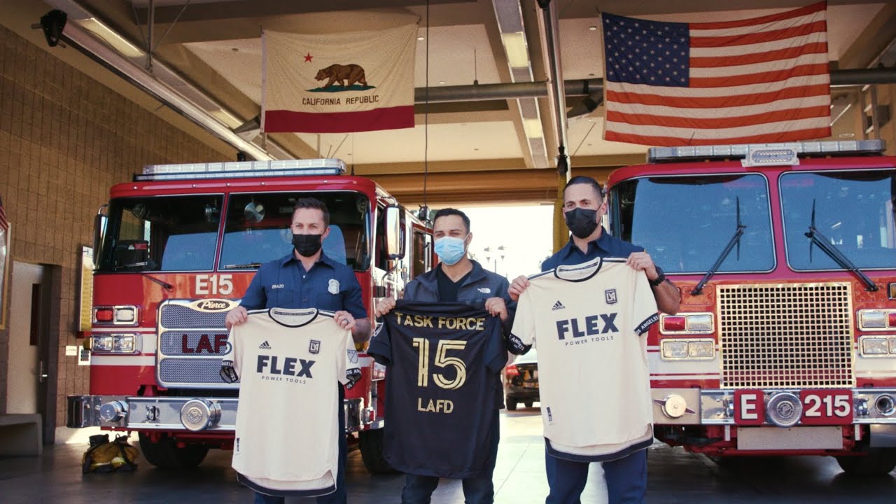 Los Angeles firefighters holding LAFC FLEX jerseys